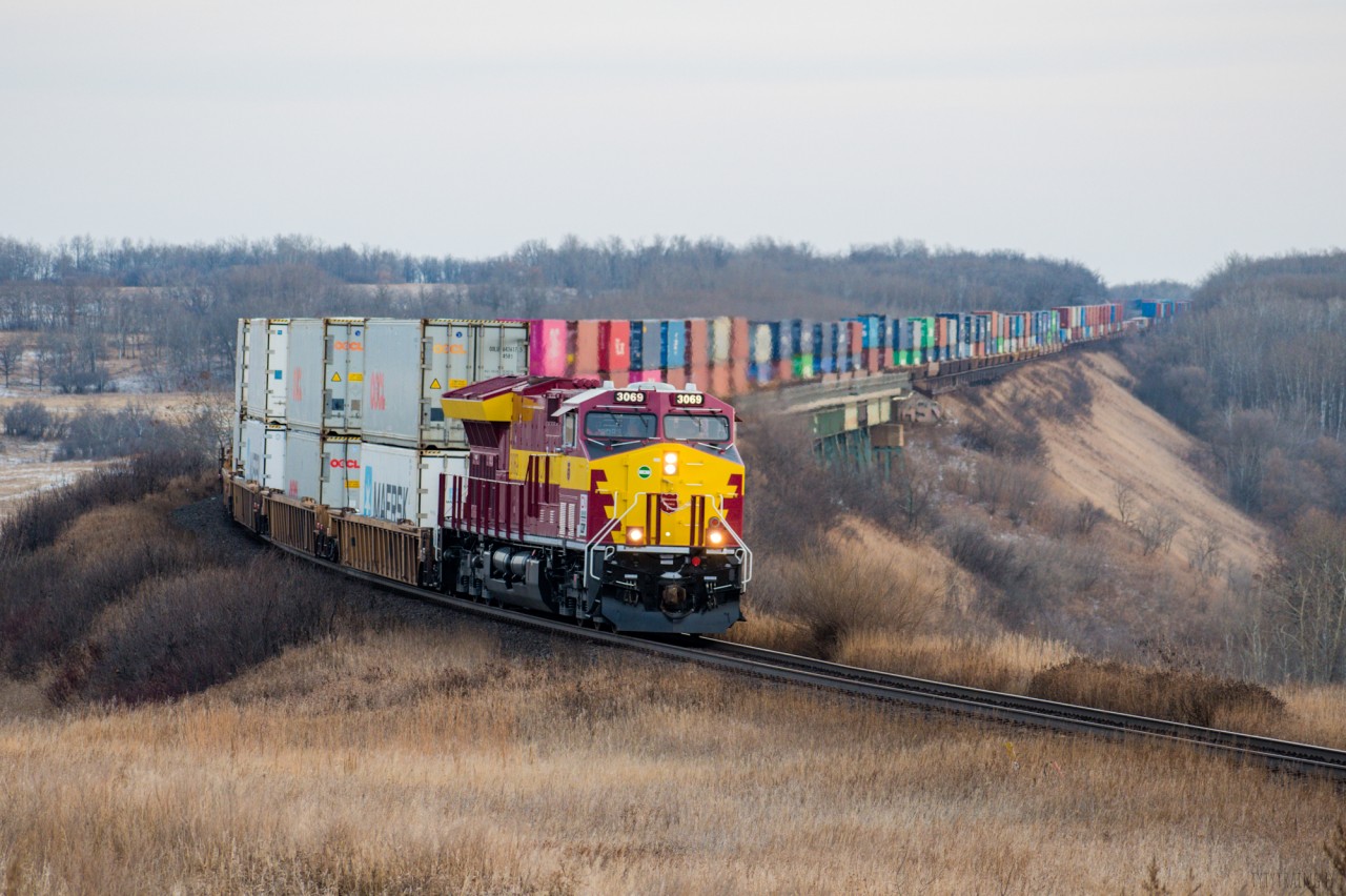 After sitting in the hole for a couple of hours CN 3069 on the point of Q117 makes the final leap into Rivers for a crew change. Although this attempt at the WC scheme isn't particularly anyone's favorite I must say it's pretty cool to see anything at all.