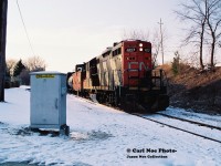The CN 15:30 Kitchener Job with 4107 is about to cross Guelph Street in Kitchener on the Waterloo Spur as the crew is on the home stretch back to the Guelph Subdivision as they returned from Elmira. As this was a Friday, the crew likely started early as they occasionaly did to complete their switching and work week sooner. Following their journey on the Waterloo Spur their next destination was likey a trip down the Huron Park Spur in Kitchener to service the Budd Plant. 