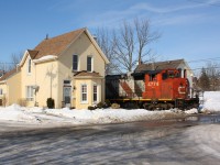 CN 4774 leads train 580 between the houses on Port Street in Brantford Ontario on their way to service Ingenia Polymers.  CN's time on this line was about a year away from abandonment at this point.  Ingenia would step in and purchase the line and then contract the SOR to run it until 2018 when CN took back the Hagersville Sub and SOR's running rights on the Dundas were removed.  Today Ingenia uses Allied Rail Services to move cars from the CN interchange to the plant, they utilized a track mobile for this move.