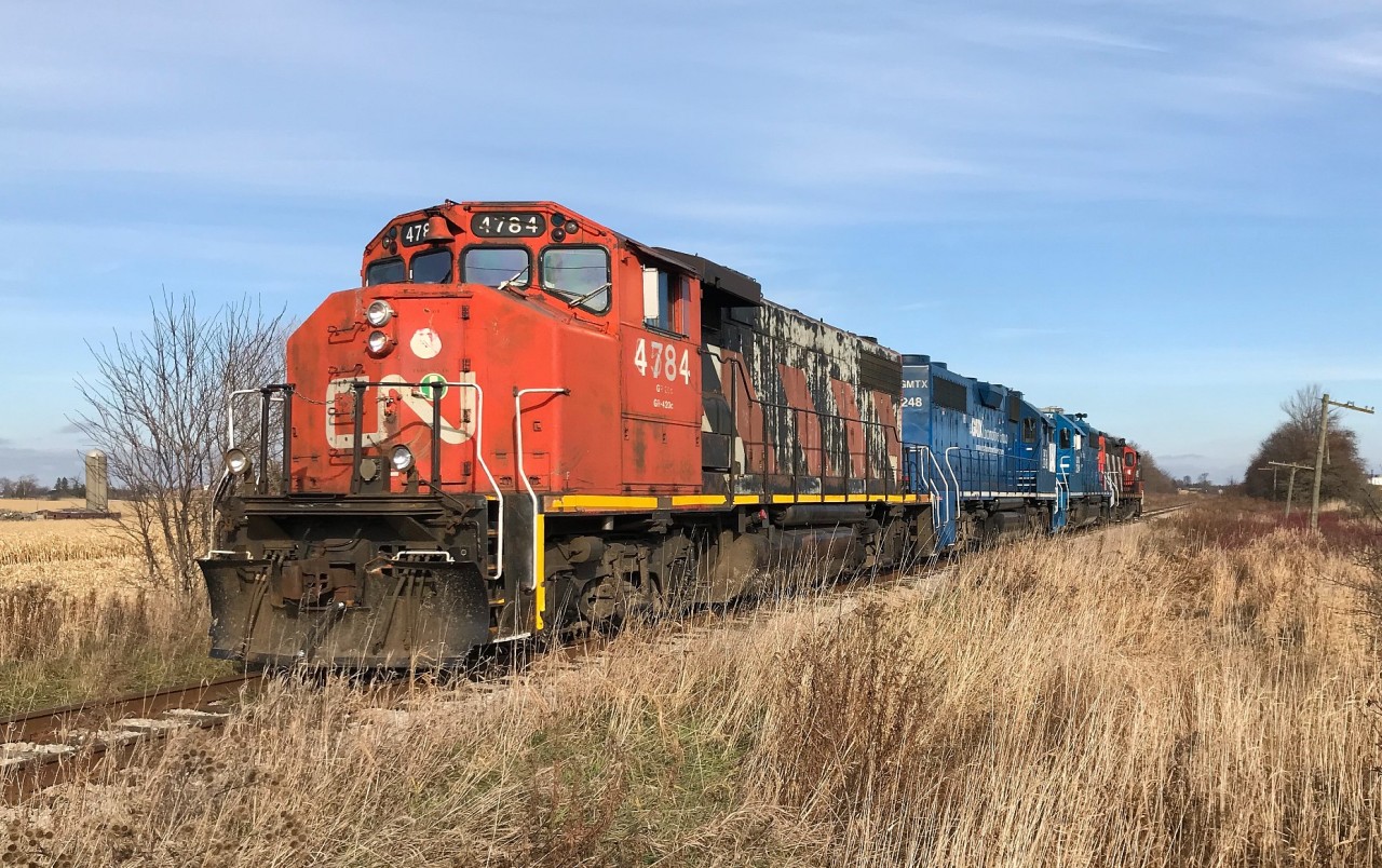 CN L568 is just west of Baden, Ontario on the Guelph Subdivision as it heads westbound to Stratford with light power. The consist included; 4784, GMTX 2248, GMTX 2254 and 4116. November 26, 2019.