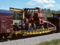 I heard the horn blowing at home and looked out the back window to see an abbreviated Edmonton Auxiliary going by. Hop in the car for some pictures and as this part of the train is coming, I spy these 3 guys sitting amongst the equipment. Had to catch a photo of this. Two in chairs and the one fellow laying on a table over top of the freight truck (you can see his bare arm and jeans). What are the chances today of seeing this sort of thing? On a beautiful day like that, I would have been out there with them enjoying the breeze. Don't know the reason why the auxiliary was called, they headed for somewhere in the Fort McMurray area. The lineup was the 4217 and 4603 up front, a flat car of snap track, coach 54957 (dozer accomodation), 57958 (auxiliary gen/comm), 54907 (flat with dozer)and 2 cabooses 79655 & 79692. They returned 4 days later, but minus coach 54957.