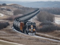 CN recently has painted 5 or 6 depending on if you count the one with regular CN paint, and right after they arrived in Winnipeg, Manitoba CN 3008 was put on an oil train on the PNL (Prairie North Line) I took no chances in deciding whether or not to see it. I had this shot in mind but have never shot in this location before. It was slightly rushed but turned out well in my opinion.
