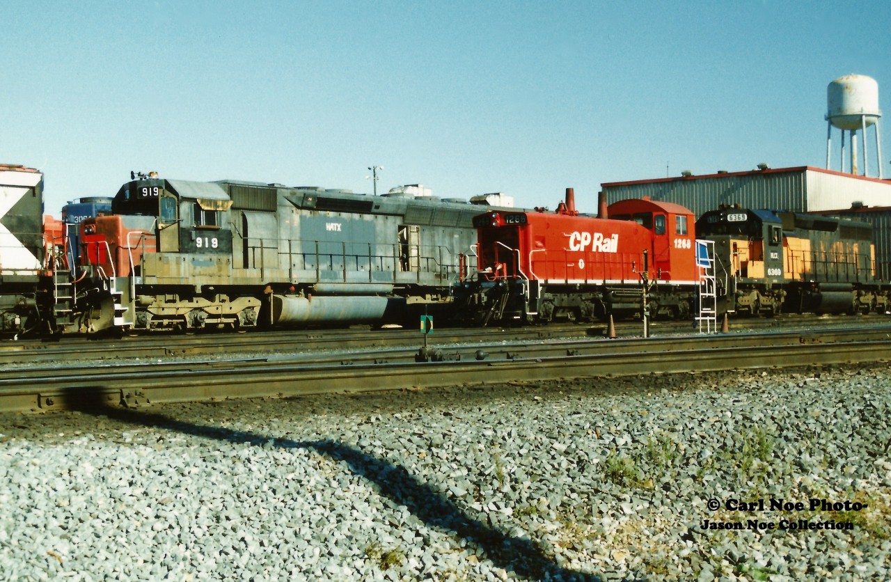 CP SW1200RSu 1268 looks relatively small in comparison to HATX SD45R 919 as they await their next assignments at CP’s Toronto Yard diesel facility. The HATX unit was former SP SD45 9131, built in January 1970 while CP 1268 was built as SW1200RS 8146 during May 1959, eventually seeing a rebuild in 1985. The photo was taken during the time period of the great CP lease fleet era of the mid-1990's when the railway was leasing hundreds of units from various companies.