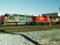 CP SW1200RSu 1268 looks relatively small in comparison to HATX SD45R 919 as they await their next assignments at CP’s Toronto Yard diesel facility. The HATX unit was former SP SD45 9131, built in January 1970 while CP 1268 was built as SW1200RS 8146 during May 1959, eventually seeing a rebuild in 1985. The photo was taken during the time period of the great CP lease fleet era of the mid-1990's when the railway was leasing hundreds of units from various companies.