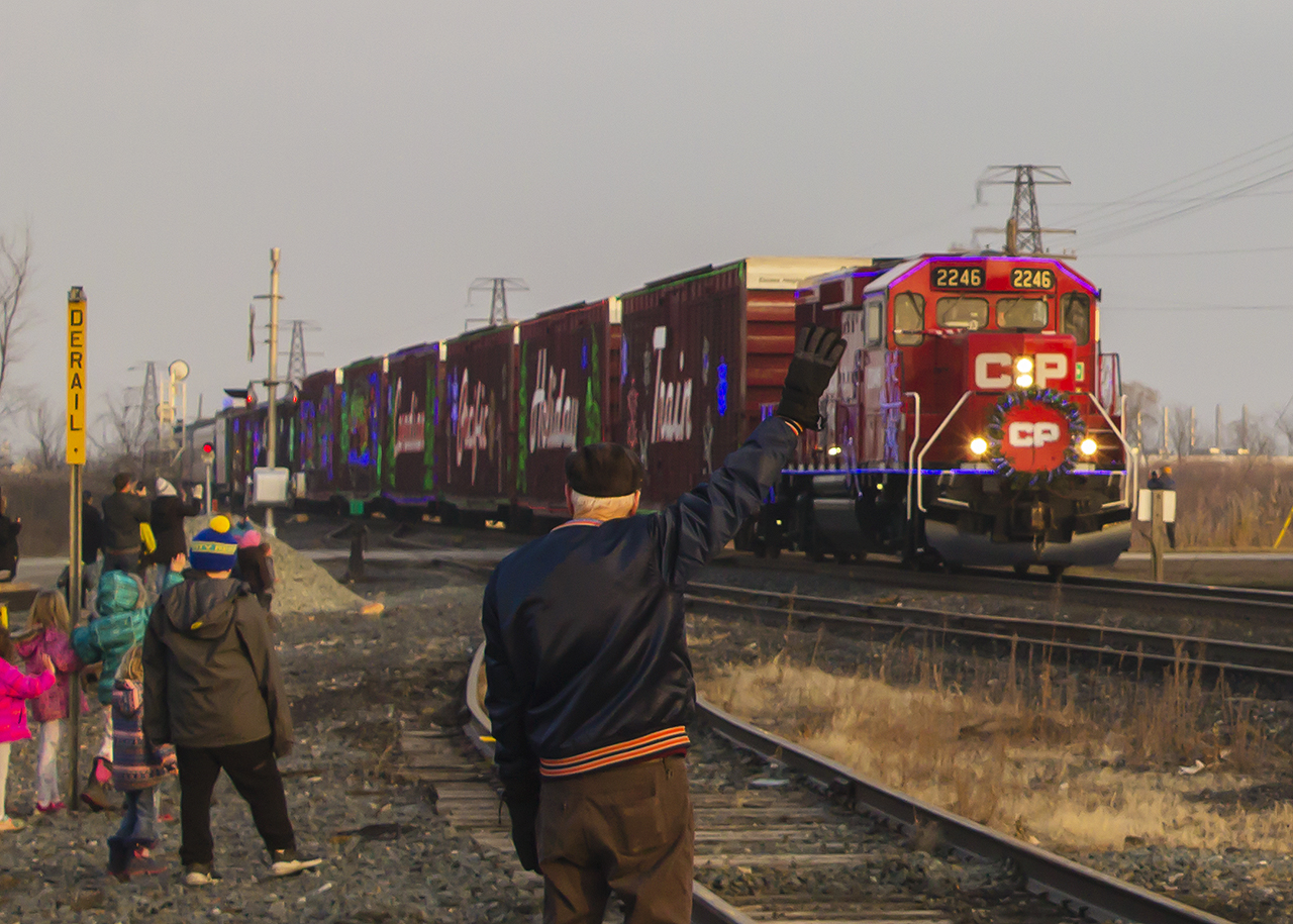 With a little over a week to go, we are all reminded of an event that will be virtual come mid-December. Thanks to the current pandemic, we will all miss seeing the Holiday Train. However, as COVID will in time become a memory, I am thankful for this event as I have met some interesting people. 


Enter Mr. Rogers Humphrey Rogers that is. Not to be confused with the beloved TV personality, but oddly enough was on the other side of the tracks where his childhood neighborhood used to be. He remembers seeing various trains, as well as meeting all kinds of people that used to embark or disembark at the CP's station. Or, like the team he met most of the Red Wings, from the Original 6 era...players like Red Kelly, Gordie Howe, and 'Terrible' Ted Lindsay. Back when teams traveled by train between all six NHL cities, and the players would gift an interested young lad with a piece of memorabilia. In Mr. Roger's case, it was an autographed stick, as the train had a bit of a wait at Tilbury while en route to Union Station in Toronto for a game against the Maple Leafs. 


And he remembers the day that the station was removed at Tilbury, as well as his old stomping grounds being removed one bit at a time that made way for what is now the Industrial Park. But most interestingly, he remembers his fond years working for the Canadian Pacific, and just how much things have changed. It certainly made for some interesting conversation, since the Holiday Train was delayed on its journey out of Chatham because of a late CP 140. But I am happy to have had this once in a lifetime experience, speaking with a true railway employee, and capturing the friendly wave of one generation to another of railroaders.