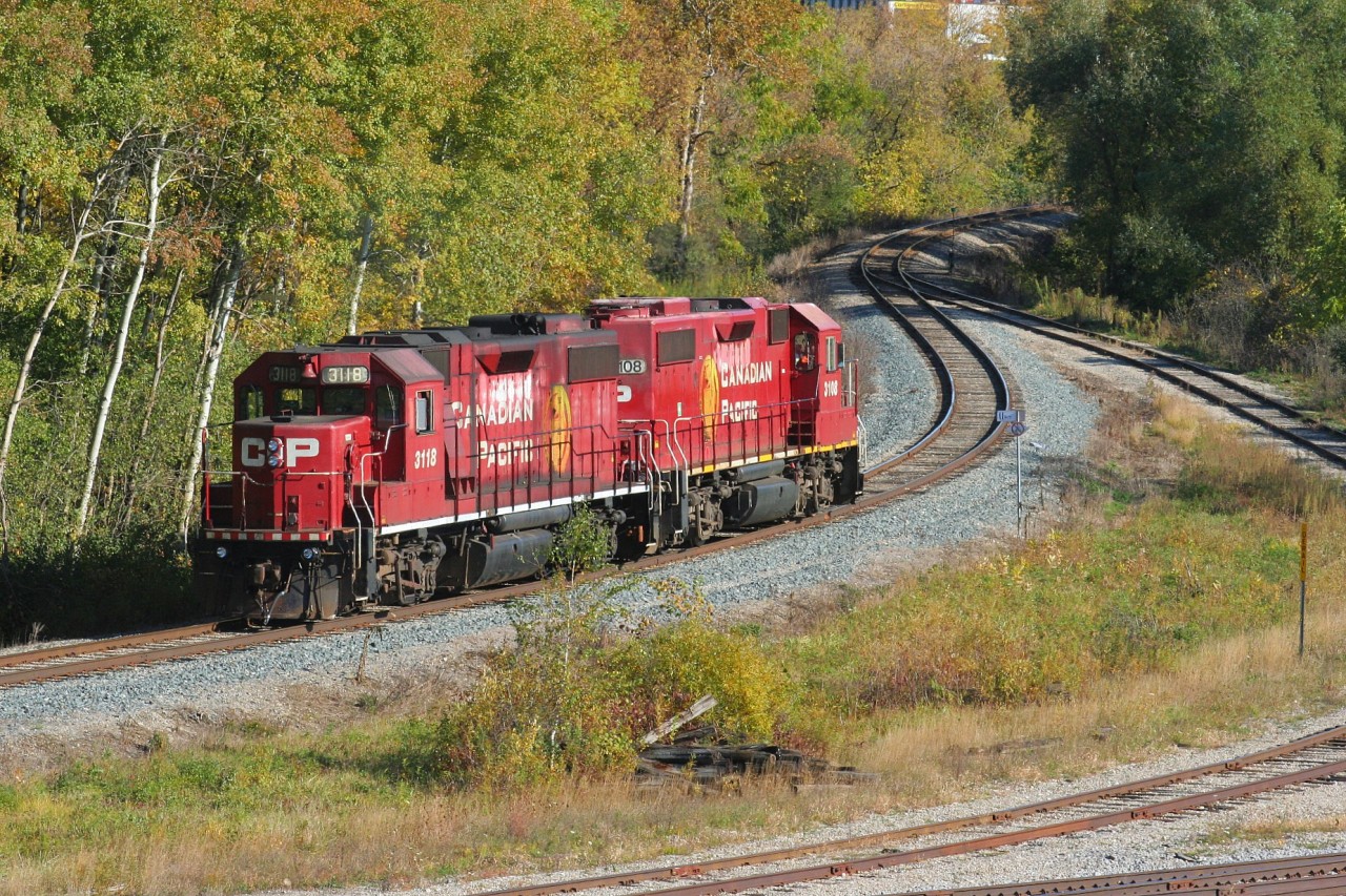 CP T97-18 with GP38-2's 3108 and 3118 are departing Kitchener on the Waterloo Subdivision after setting-off cars for CN at the busy CN/CP interchange. The units are both still adorned in the "Golden Beaver" paint scheme that was launched by CP in 1997. T97-18 would return to it's base at Hagey yard in Cambridge, which is about 4 rail miles south.