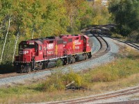 CP T97-18 with GP38-2's 3108 and 3118 are departing Kitchener on the Waterloo Subdivision after setting-off cars for CN at the busy CN/CP interchange. The units are both still adorned in the "Golden Beaver" paint scheme that was launched by CP in 1997. T97-18 would return to it's base at Hagey yard in Cambridge, which is about 4 rail miles south.