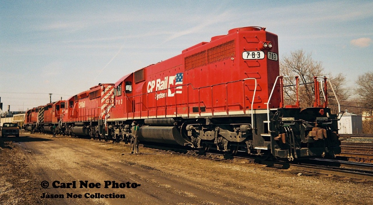 A westbound CP train has arrived at Quebec Street yard in London with 5585, 5599, 6038 and 783. The power is seen having just uncoupled from their train and will soon head to the shop where 5585 and 5599 would be set-off.


Unit Dispositions
CP 5585 would be retired in March 2008 and then sold to RB Recycling Group in Montreal for scrap.

CP 5599 was retired in July 2008 and then sold to J&L Consulting in Langley, BC during 2010.

CP 6038 was active up until 2015 and was eventually stored unserviceable and now possibly stored/retired. 

CP 783 was former SOO Line 783 and was repainted/renumbered into CP 783 during October 1993. It was retired during 2001 and sold to National Railway Equipment in September 2004, eventually becoming NREX 783. 

Unit notes from- www.mountainrailway.com.