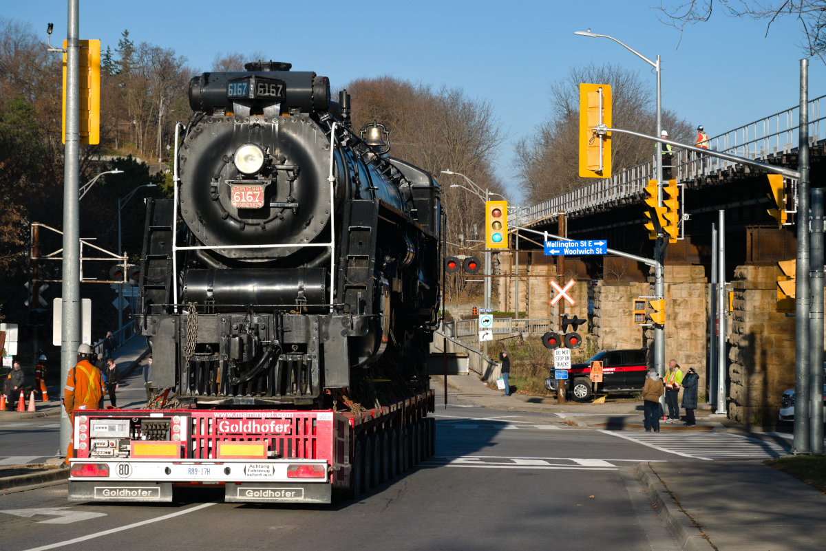 On November 14, 2020, Canadian National 6167,owned by Guelph Museums, moved from it's home by the Guelph Central GO station to John Galt Park, named after the founder of Guelph, John Galt. 

This move was needed to make way for the expansion of the GO train station. All told the city of Guelph will have likely spent close to 1 million on this move, while a lot, the preservation of this magnificent engine continues and it's new location is a visible, important part of Guelph's history, certainly a fitting spot for this engine.

 To the right of 6167 is Allan's Bridge, the CN/Metrolinx Guelph Sub and the tracks behind the locomotive are the city owned Guelph Junction Railway. 6167 was moving backward toward the tracks where it will sit beside the GJR.