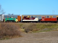  The Ontario Southland Cami job is shoving some autoracks into the Cami plant passing the Ex Port Stanley Railway van 67 with the brand new repaint on 1245 and the cp red 1210. 67 is now in service as a shoving platform for the Cami jobs when they go to beachville to interchange with Canadian National.

