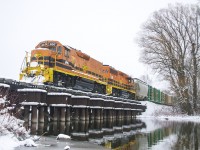 GEXR 582 trundles through a snowy scene crossing the Eramosa River.