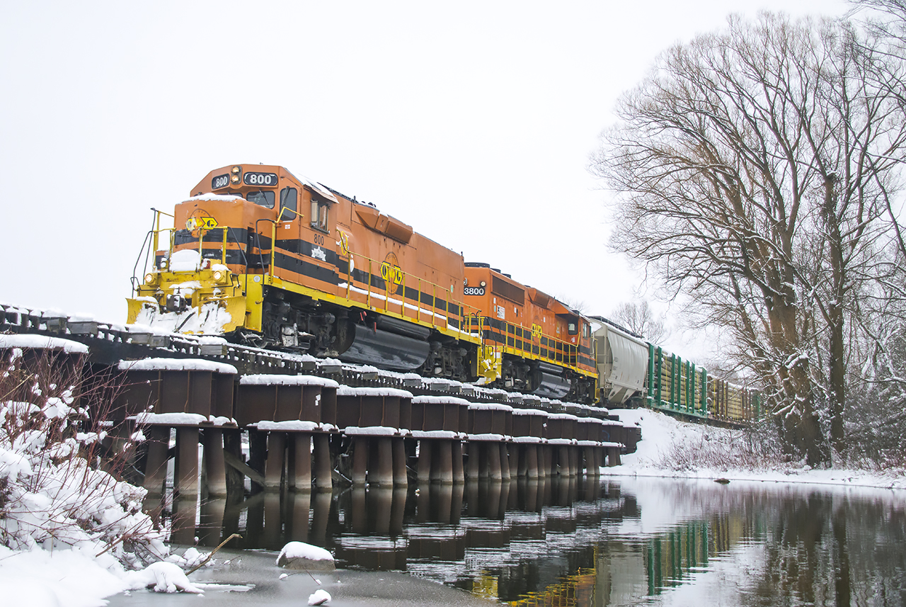 GEXR 582 trundles through a snowy scene crossing the Eramosa River.