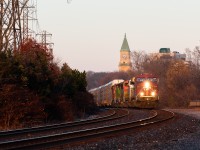Sandwiched between 2 CP GEs, 3 ex-BN triclops SD60Ms hitch a ride dead-in-tow on CP 147 as it flies through Summerhill at last light. The 60Ms are believed to be heading back to their owner (CIT group) after being on lease to the CMQ.