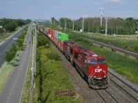 The last CP ES44AC to have part of its Olympic paint scheme intact (CP 8876) is trailing CP 8920 as CP 119 heads west through Pointe-Claire.