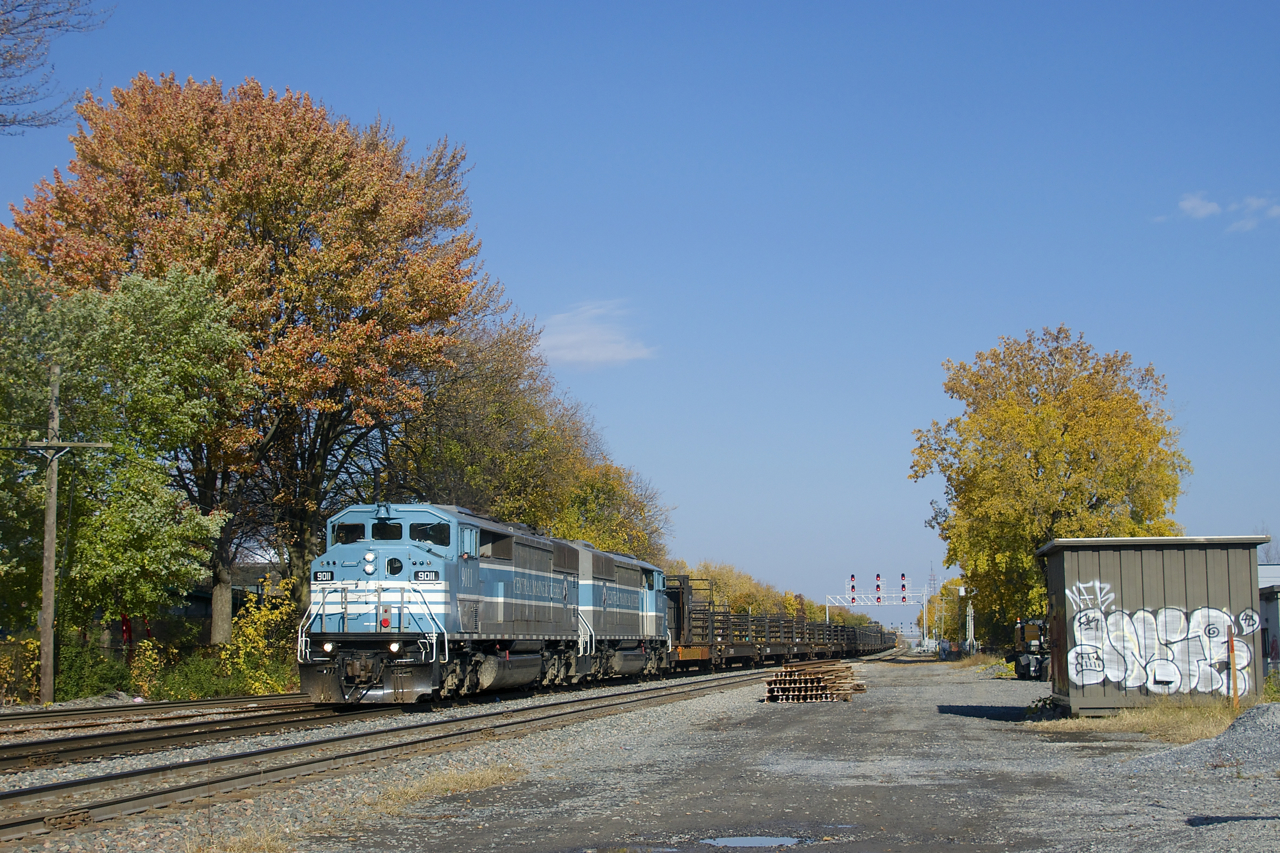 After dropping rail on track 2 of CP's Westmount Sub, a rail train powered by CMQ 9011 & CMQ 9014 is heading back to St-Luc Yard just before the start of the afternoon commuter rush hour on this normally passenger-only line.
