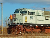 CP 7022 northbound #247, seen switching in Welland yard, Wainfleet ON.
CP 7022 wears the grey, red and black colour pattern of modern Canadian and American warships, and to me, it appeared that the conductor (seen here) was imagining himself on the bow of a ship sailing across the Atlantic (as so many of our fathers and grandfathers did during the Second World War)