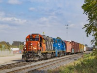 CN L568 pulls west down the siding at Kitchener to double onto it's train waiting a few tracks over and head for Stratford.  After departing west, CN X568, the OSR equipment move (headlight at right) will pull ahead to the crossover and shove back into the yard to end the crew's slow trip from Guelph.