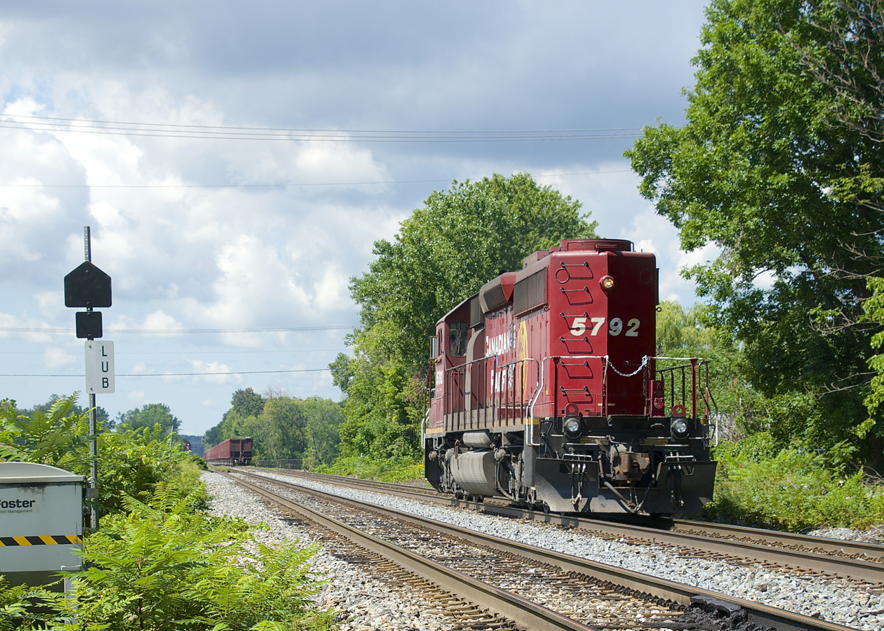 CP 5792 is running around its train and will soon run back to St-Luc Yard long hood forward with empty ballast cars.