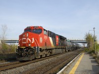 CN 100 unit CN 3219 leads CN 377 through Dorval. 81 cars back is CN 2966, with 75 cars behind the DPU.