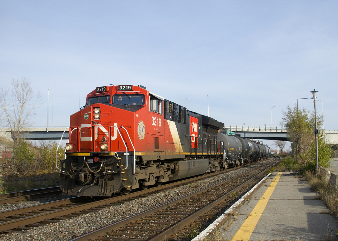 CN 100 unit CN 3219 leads CN 377 through Dorval. 81 cars back is CN 2966, with 75 cars behind the DPU.
