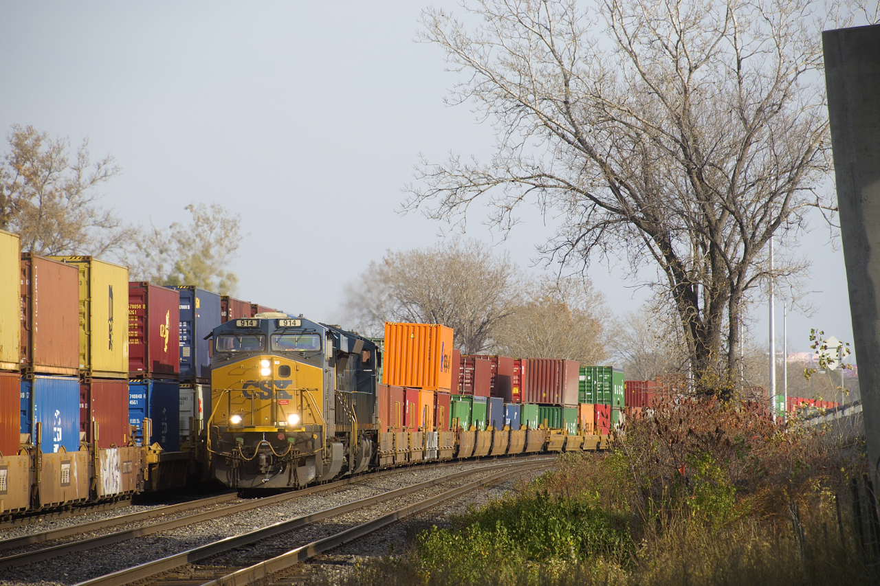 CN 327 with intermodal up front passes an intermodal train stopped on track DX-1.