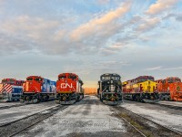 <B><I>CN Celebrates the 25th Anniversary of its Privatization!</I></B>
<BR>
<BR>
On November 17th 1995, CN’s shares were listed on the TSX and NYSE. Since then, CN has acquired the Illinois Central Railroad, the Wisconsin Central Railroad, the Elgin, Joliet & Eastern Railway, and BC Rail. Each of those railways, as well as the Grand Trunk Western, are represented by one of the locomotives specially painted by CN for the 25th anniversary of its IPO.
<BR>
<BR>
CN 3115 (BC Rail), CN 8952 (GTW), CN 8898 (CN), CN 3008 (IC), CN 3069 (WC), CN 3023 (EJE)
<BR>
<BR>
Picture was taken with permission.