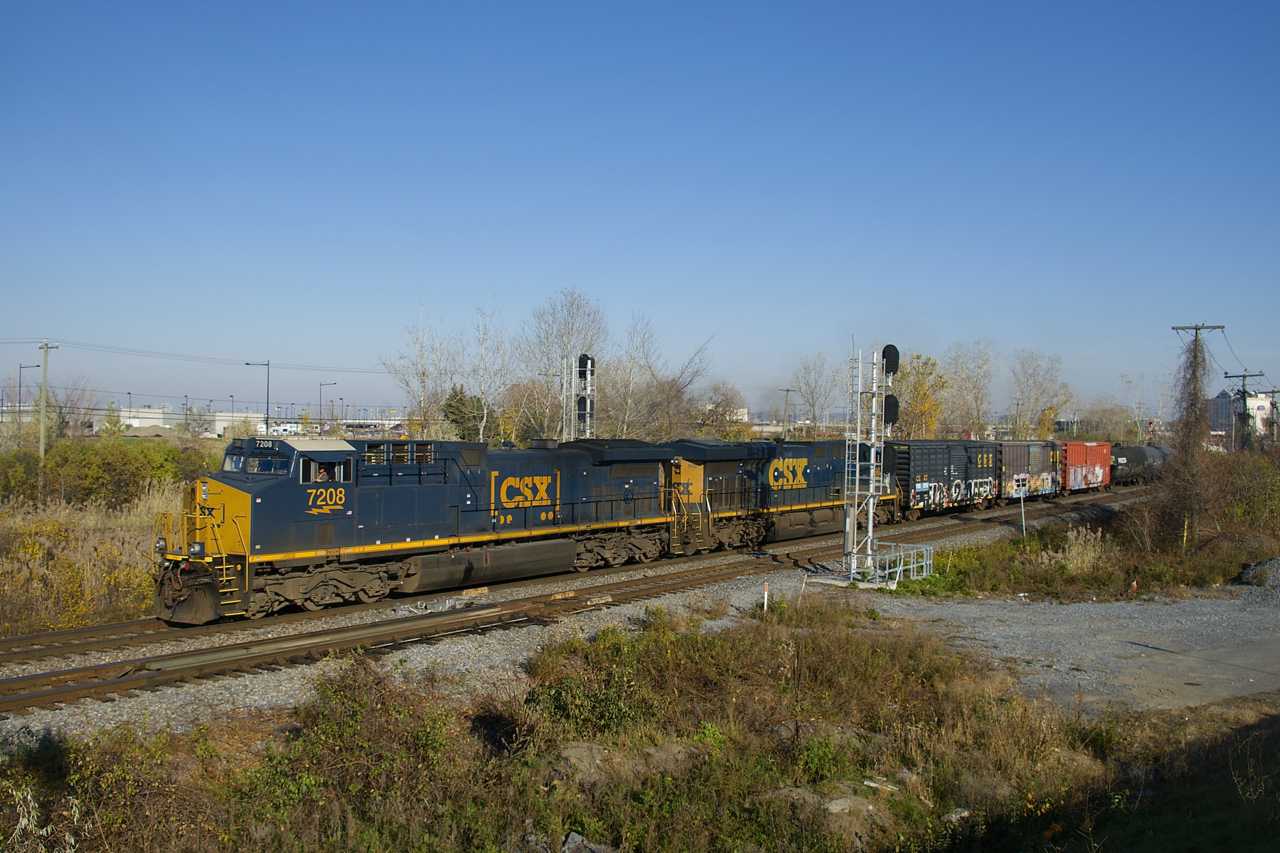 After waiting for VIA 67 to make its station stop on the south track and then cross over to the north track once it departed, CN 327 is on the move with rebuild CSXT 7208 leading (ex-CSXT 227), CSXT 903 trailing and only 49 cars.