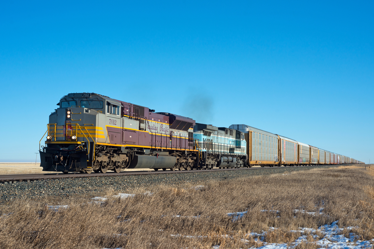 A sunny afternoon in sees 197 making it's way north on the Weyburn subdivision near the town of Lang Saskatchewan with a great consist.  CP 7012 and CEFX 1002 make for a wonderful change from the normal.
