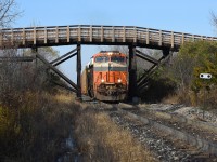 CP 244 passes under a recently modernized wooden truss-style pedestrian located just off Sarnia Rd between between Hyde Park and Wonderland with Norfolk Southern's Interstate Heritage Unit in the lead. Once in London the outbound crew would quickly add CP 4447 to the lead before continuing East to Wolverton