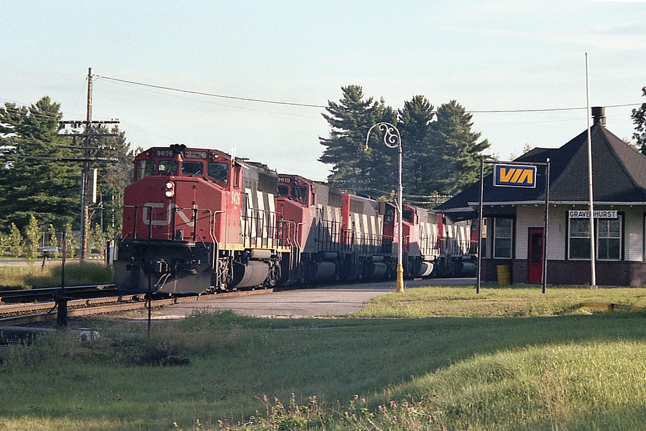 Got fooled by this one. Saw the string of head end power coming around the bend while at the station taking pictures. Backed up abut as far as I could go and thought I had all the units, 5 of them, in the shot. But no, there was a 6th, CN 4521 that didn't quite fit in the photo.
This Toronto to North Bay train was very late in the day, the shadows lengthening quickly.  So nice set of GP40-2s up front; CN 9426, 9619, 9654, 9447 and 9603.
Currently the VIA station is up for rent. It sits empty.
None of the GP40s remain on the CN roster. It is surprising that after 40 years only 9619 is officially retired.  The 9426 is now RLK 3029, 9654 is Central Michigan 9712, 9447 went to Alstom in 2001 and 9603 went to the DMVW in 2002.