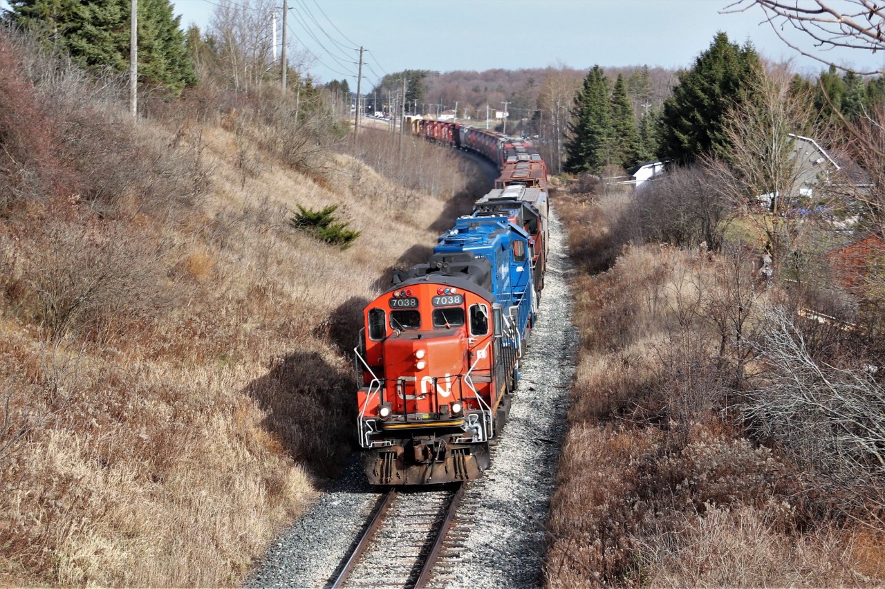 After barely missing this train In Guelph headed for Acton, I decided I'd head out Rockwood way and catch it on the way back. I chose this location to get above the weeds along the road so CN 7038 with GMTX 2279 and CN 4725 head under the Jones Baseline overpass with a short train on a nice bright fall afternoon.