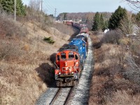 After barely missing this train In Guelph headed for Acton, I decided I'd head out Rockwood way and catch it on the way back. I chose this location to get above the weeds along the road so CN 7038 with GMTX 2279 and CN 4725 head under the Jones Baseline overpass with a short train on a nice bright fall afternoon.