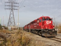 In the Kenilworth and Beach area of Hamilton's north end, CP switches the yard between Ottawa St. and Kenilworth Ave. with CP 4522-3113-7307 on a sunny and warm fall morning.