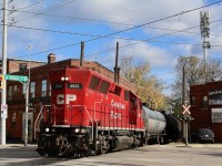 I never imagined I would ever catch a former GP40X on the former TH&B belt line but as luck would have it, it was transferred several weeks ago from Welland. Only 23 examples of this unique test bed model were ever built. It raised the horsepower of the original GP40 to 3500hp, and would later lead to the creation of the GP50, which unfortunately not include the distinctive flared air intake grills. A number of years ago CP looked to Helm for a small group of GP38's to help fill its motive power needs. A few of these units included rebuilt former Union Pacific GP40X's. In the end they lost their original prime movers and unique HT-B trucks. One roof top fan was removed along with the addition of a paper air filter box where the original turbo charged exhaust stack as located, and new exhaust stacks were added. I typically am not fond of shooting the long hood of a locomotive in the lead but for the GP40X this is the preferred end for me. Here we see CP 4522 running solo across the intersection of Gage and Main in Hamilton as it returns for Hamilton's industrial core. 