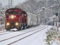 CP T14 began regularly working Hornby yard a few weeks ago so typically they run there first before working Streetsville. Here they are seen returning back to Streetsville and passing through a bit of a winter wonderland after lifting a cut of tank cars. The location here is the Meadowvale GO station, and T14 will cross over to the south track in less then a mile before stopping and backing into Streetsville yard.