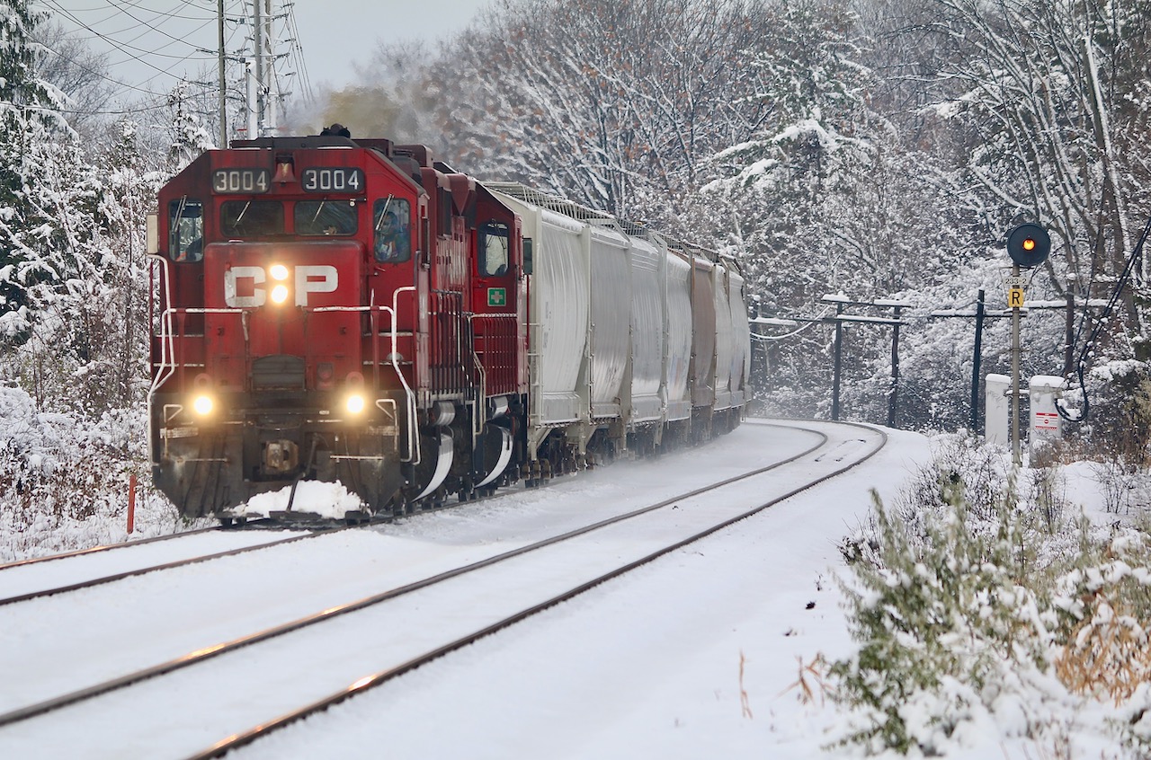 CP T14 began regularly working Hornby yard a few weeks ago so typically they run there first before working Streetsville. Here they are seen returning back to Streetsville and passing through a bit of a winter wonderland after lifting a cut of tank cars. The location here is the Meadowvale GO station, and T14 will cross over to the south track in less then a mile before stopping and backing into Streetsville yard.