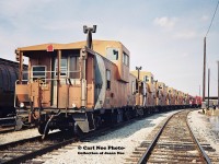 Six active CP cabooses are seen being moved by a pair of SW1200RS's in the railway's Toronto Yard during spring 1994.