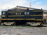 Former CN S13 unit 8511, now lettered as MLS 8511, is seen at railway equipment dealer Andrew Merrilees' yard in Lachine QC in May of 2000.