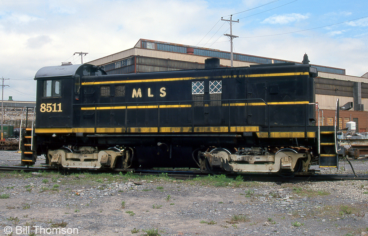 Former CN S13 unit 8511, now lettered as MLS 8511, is seen at railway equipment dealer Andrew Merrilees' yard in Lachine QC in May of 2000.