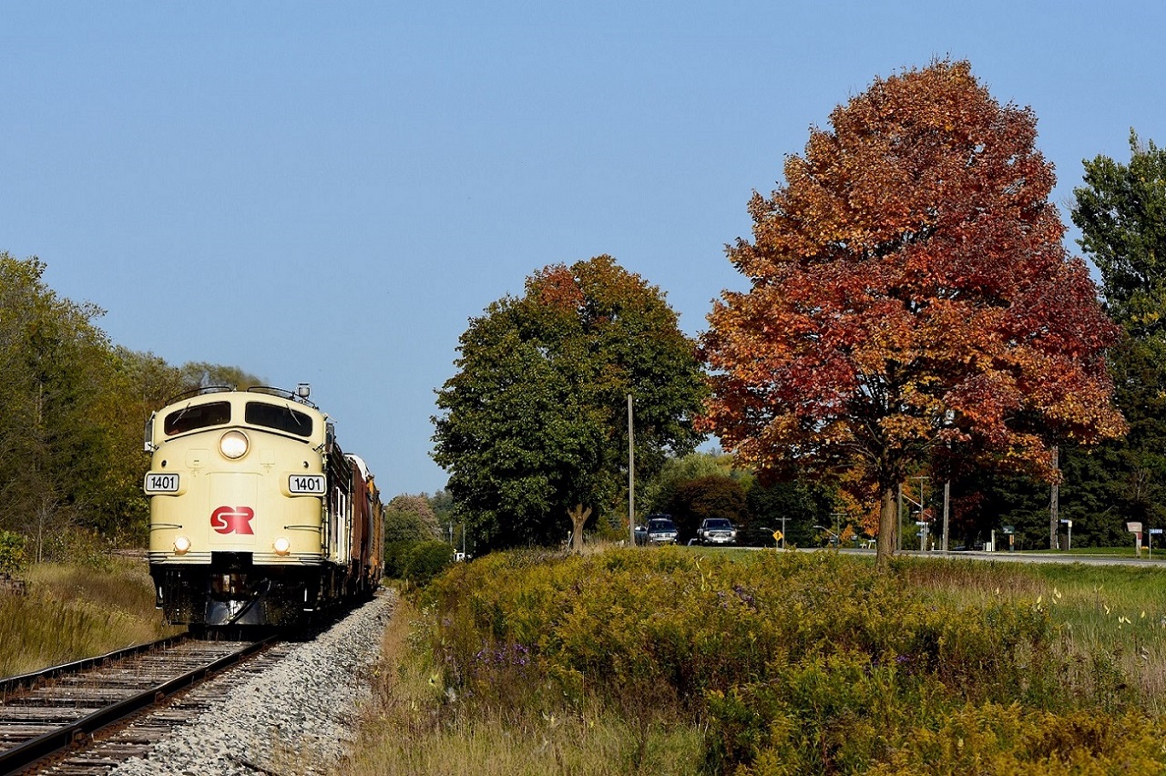 Fall colours are in full swing as Ontario Southland's prized F units lead the way West towards Ingersoll after having to wait a good hour for CP T69 to show up.