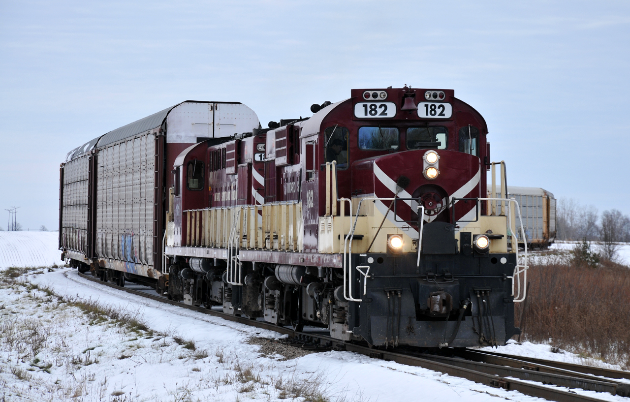 The "Woodstock" job works to assemble their train at Cami with matching RS18's 182 - 181 leading the way. They would depart for Woodstock with 17 autos, 5 hoppers, and 6 tanks