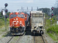 One of my most favourite shots! I know how lucky I have been to live my boyhood dream of being a locomotive engineer. I was blessed to have the biggest train layout to operate.For me this shot captures the sights, sounds and smell of railroading at its best.3021 departing Mac Yrd on the Halton outbound track while I follow an eastbound up to Jane St as it enters Mac Yrd on the Halton inbound . My train will wait for a better signal to enter the yard. I would hang up my throttle about a year after I took this shot. Not a day goes by that I don't miss being an engineer.