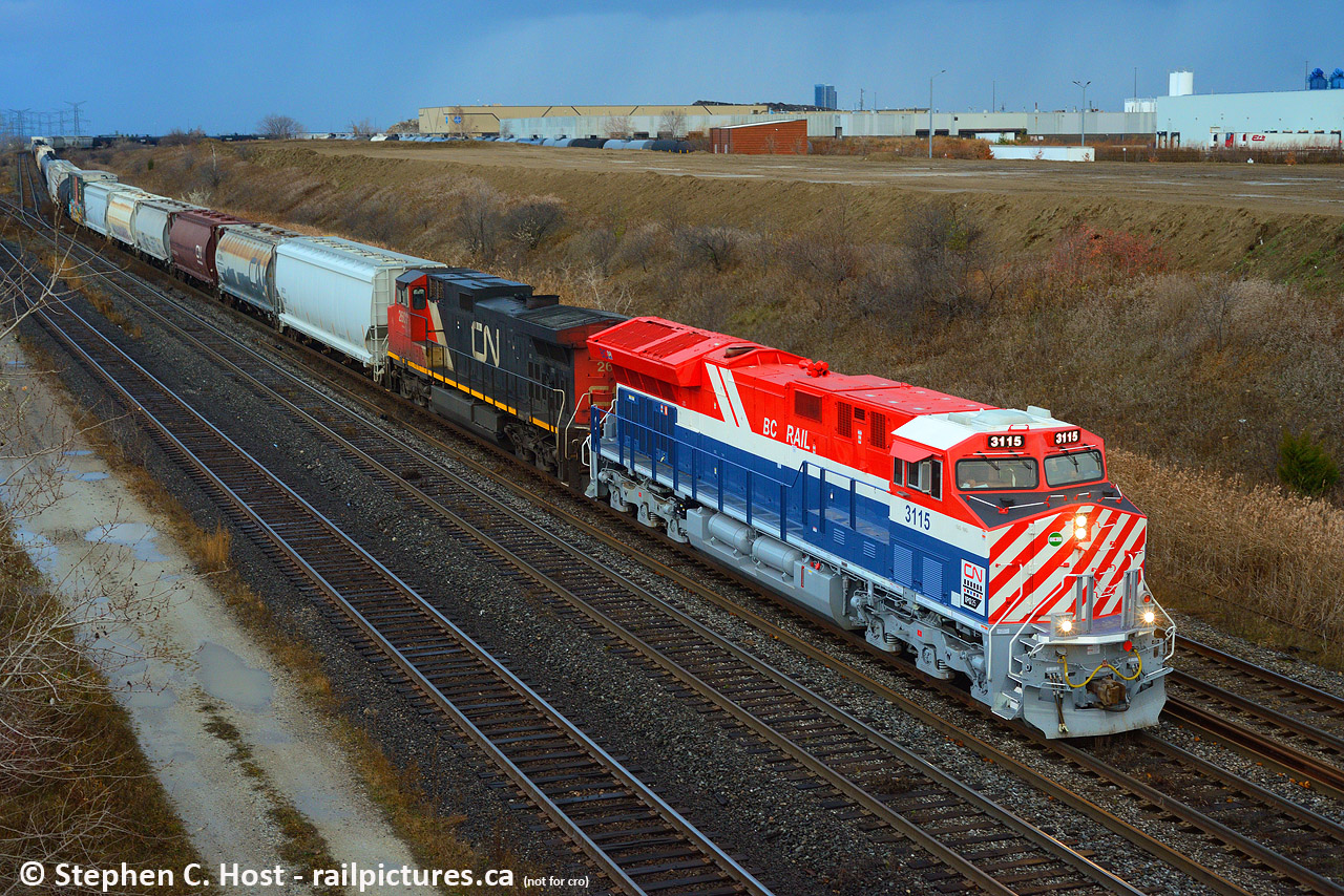 The first CN heritage unit on the road leaqding a train is departing Mac Yard under very stormy skies. Heads up to you Montreal folks! It begins.....