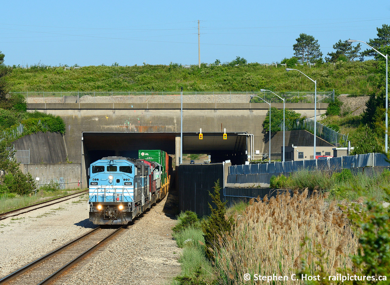 Well, I think on this cold 'wintery' day in Ontario it's time to post some sunny summer shots, and this is my first post of this train shot back in June. I was on (forced) vacation this week and what a week, with only knowledge that this pair should run through overnight with possibility of a leader change in Toronto, all I knew is it traced west of Toronto when I woke up at 0500 and quickly left the house to intercept. Not until I was in Hamilton going over the skyway did I get confirmation by radio CMQ 9020 was actually leading. My first photo was in Welland at 0647. Thankfully they had work at Welland (rare for this train!) which gave ample opportunity for a photo on the east side of the Welland Canal. Surprisingly, I was the only one shooting the tunnel exit as everyone seemed to be gathered on the road overpasses way in the distance. As an infrastructure fan this was my #1 shot.