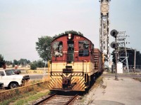 TH&B #57 has just crossed the Welland Canal Lift Bridge #20 with a single box car and Van #83 in tow bound for the Maple Leaf Mill.  The Bridges were staffed 24/7 for the 9 1/2 month shipping season.  Bridge 20 was removed less than 10 years after this photo was taken.  My trusty 1986 Vette (Chevette)is seen in the background.  