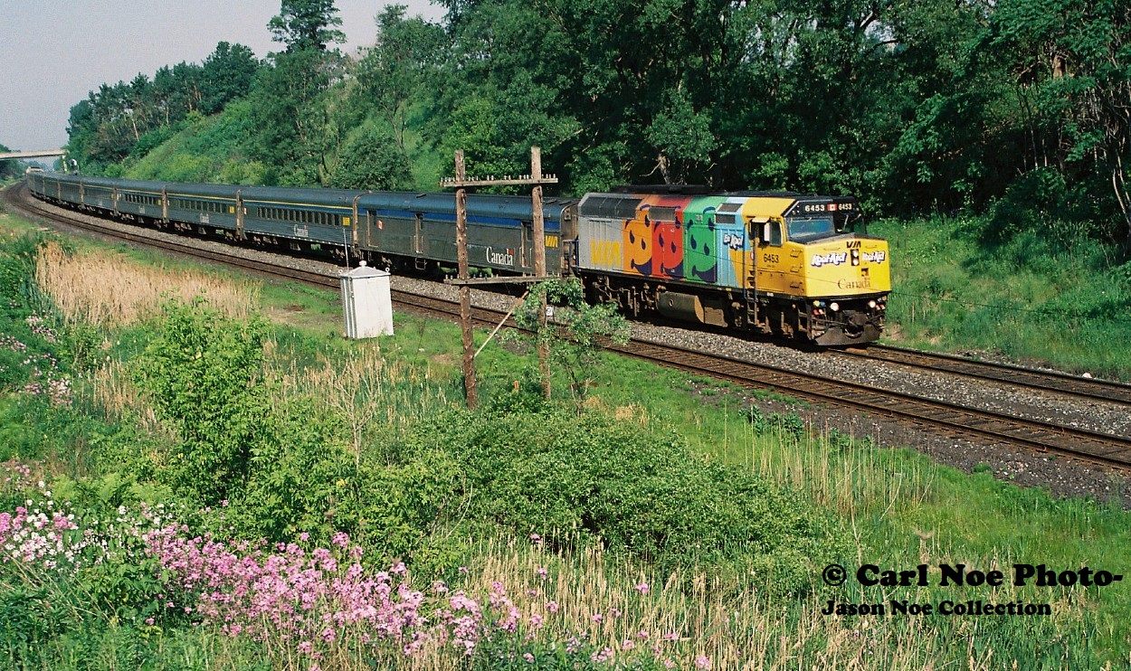 During the spring and summer of 2000 several VIA Rail F40PH-2’s were adorned with a special wrap for Kool-Aid drinks. The units included in this promotion were 6404, 6405, 6406, 6411, 6424, 6432, 6433, 6439, 6453 and 6454. These units only lasted a short time in these wraps, as they all had reverted back to the standard VIA Rail scheme by the fall of that year.