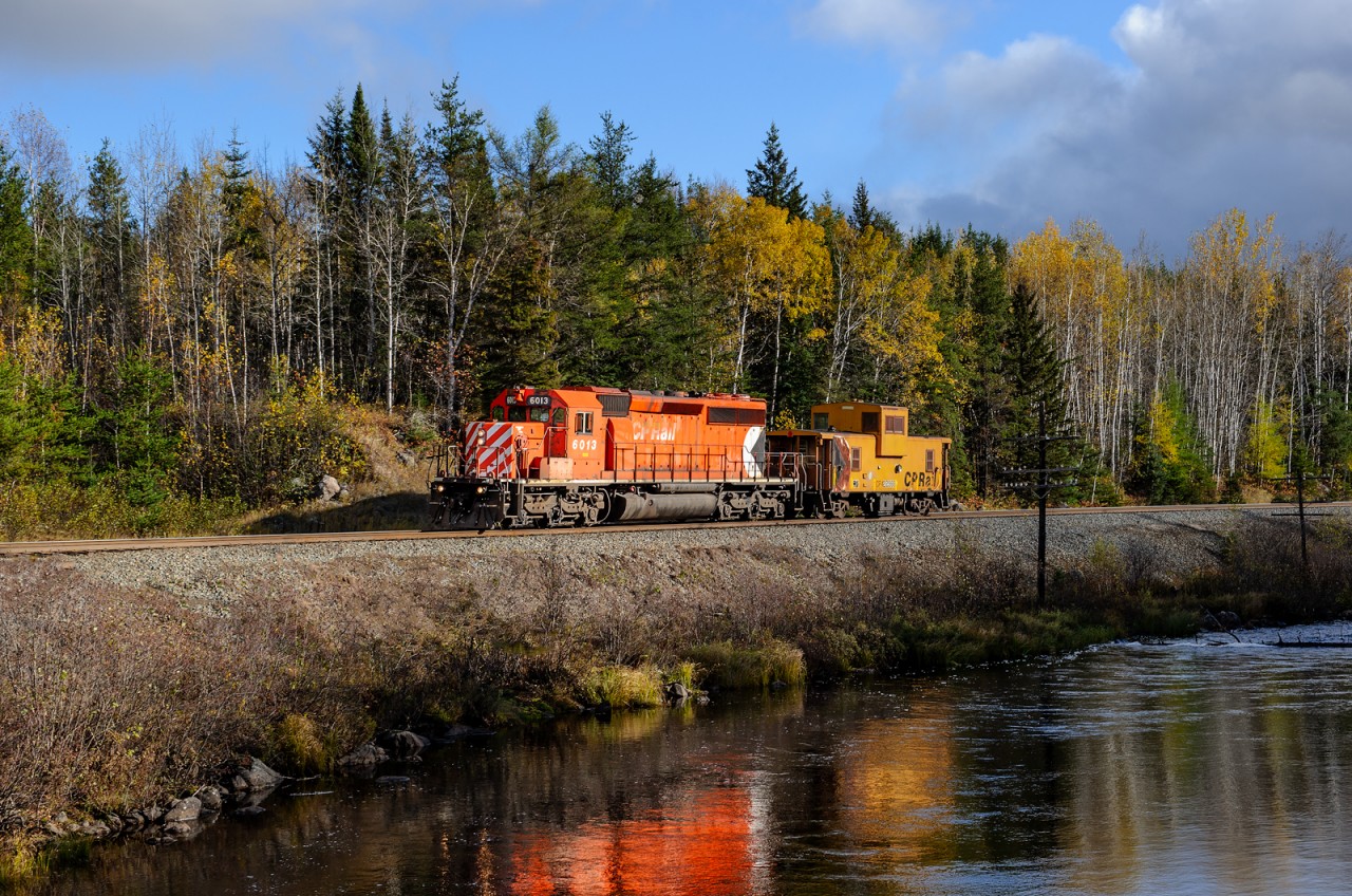 CP SD40-2 6013 hustles back to Chapleau with its van (422988) after dropping the rest of its work train off at Cartier earlier in the day. They're about to knock down the home signal at Sultan (East) on CP's very remote Nemegos Sub.