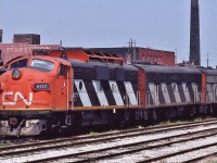 <br>
<br>
 Interesting day at the Lower Don Yard, at that time home to the SW1200RS ( CN 1300's ) with the GMD 567C series engine
<br>
<br>
 On a hot and humid Saturday Cab units CN 9177 – 9195 – 9175: GMD F7Au – GMD F7Bu – GMD F7u  await the next transfer service assignment 
<br>
<br>
 Delivered to CN during 1951-52 by GMD with numbers: 9088 - 9095 - 9132  
<br>
<br>
 all retired by 1989 with 9177 to NRE by November 1990 and on to …..
<br>
<br>
 May 17, 1987 Kodachrome by S.Danko
<br>
<br>
 what's interesting 
<br>
<br>
 lower Don Yard is now part of Toronto Waterfront Revitalize Corporation ' West Don Lands Precinct Plan' and today  remnants of any railway use is gone....near this site in the early 1980's on the way home I would stop and watch the CPR daily local job's MLW S-3 ( 6500 series )  kicking box cars through the crossing to the loading docks parallel to Front Street (south side), east of Cherry Street.
<br>
<br>
 and per AWM and SCH:
<br>
<br>
 Some of these F unit's were part of the regular Nanicoke power
<br>
<br>
 [Currently – autumn 2020 ] CN 9177 down on the Shenandoah Valley Railroad in Staunton, VA as of January 2020. Stored 
<br>
<br>
 [ and in 2020, ex CN9177 is located at ] Cresson Steel in PA waiting for a buyer… SOU 9177 is current reporting marks.. (was to be rebuilt by NS, not happening now) 
<br>
<br>
 sdfourty