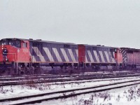 <br>
<br>
 those BBD demonstrators prowled CP Rail for 16 months: February 1983 to May 1984
<br>
<br>
 On a snowy day, BBD HR616, built 1982 by BBD ( at the former MLW 'works' ), BBD # 7002 – 7003 ( ex CN 2002 – 2003; and future CN 2002 – 2003 )  pull a 1980 built GMD SD40-2  ( CP Rail 5977 (?)) through the turnouts at the east end CP Rail Agincourt.
<br>
<br>
February 4, 1984 Kodachrome  by S.Danko
 <br>
<br>
more BBD action: 
 <br>
<br>
 <a href="http://www.railpictures.ca/?attachment_id= 15477">  on the high rail    </a>
 <br>
<br>
 <a href="http://www.railpictures.ca/?attachment_id= 15019">  in a sea of CP Rail    </a>
 <br>
<br>
 <a href="http://www.railpictures.ca/?attachment_id= 22646">  in the snow by darrell    </a>
<br>
<br>
 sdfourty

