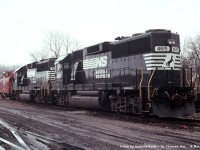 Norfolk Southern GP59's 4615, and 4618, plus an N&W wide vision caboose await their next assignment in St. Thomas on March 16th, 1990 